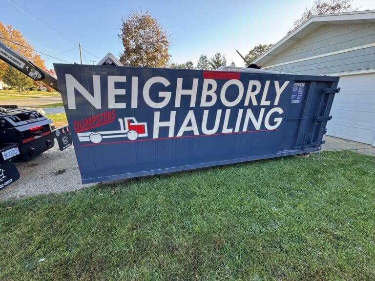 21 yard dumpster rental in West Michigan placed on residential driveway with driveway protection