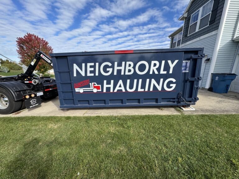 25 yard dumpster rental from Neighborly Hauling placed on a residential driveway in West Michigan