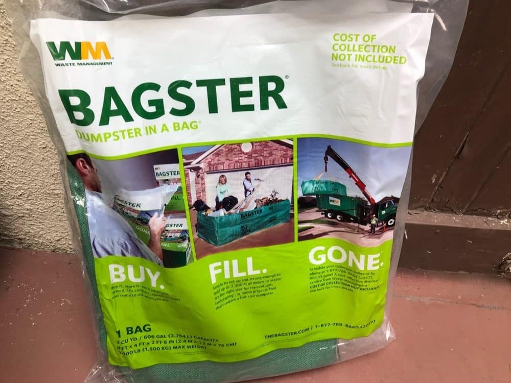 Bagster "Dumpster in a Bag" packaging showing "Cost of Collection Not Included" — Waste Management Bagster sold at hardware stores.