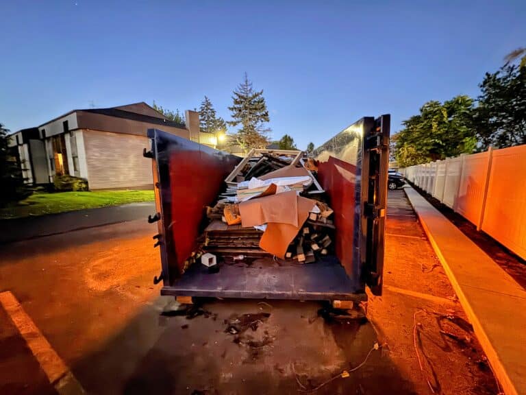 Commercial dumpster rental used for an after-hours property cleanout in West Michigan