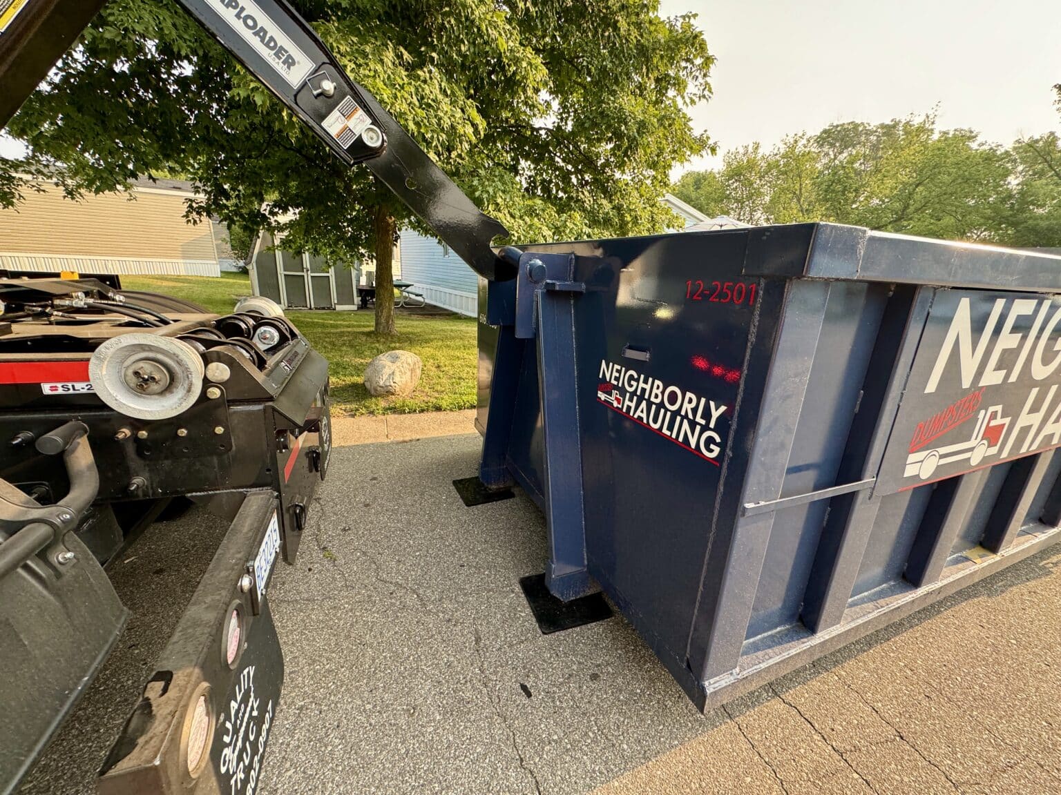 roll-off dumpster positioned on residential driveway Grand Rapids Michigan