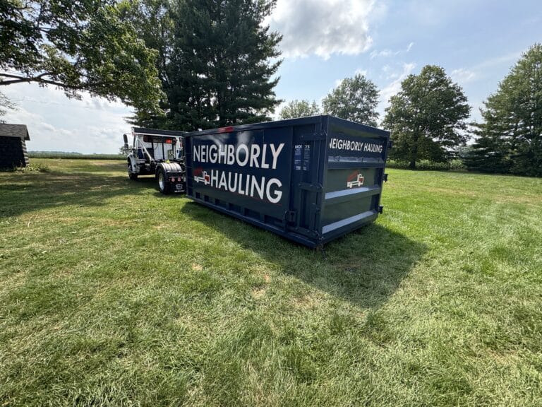 Roll-off dumpster for construction debris removal at Grand Rapids job site